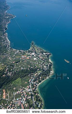"Aerial view, Malcesine, Lake Garda, Val di Sogno bay, Isola di immaginazione, Veneto, Verona Province, Italy, Europe" View Large Photo Image Stock Image - "Aerial view, Malcesine, Lake Garda, Val di Sogno bay, Isola di immaginazione, Veneto, Verona Province, Italy, Europe". Fotosearch