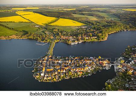 "Aerial view, Malchow with Malchower See lake and the island with the historic centre and its old market square, Malchow, Mecklenburg Lake District, Mecklenburg-Western Pomerania, Germany, Europe" View Large Photo Image Stock Photo - "Aerial view, Malchow with Malchower See lake and the island with the historic centre and its old market square, Malchow, Mecklenburg Lake District, Mecklenburg-Western Pomerania, Germany, Europe". Fotosearch