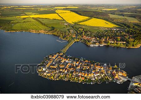 "Aerial view, Malchow with Malchower See lake and the island with the historic centre and its old market square, Malchow, Mecklenburg Lake District, Mecklenburg-Western Pomerania, Germany, Europe" View Large Photo Image Stock Photo - "Aerial view, Malchow with Malchower See lake and the island with the historic centre and its old market square, Malchow, Mecklenburg Lake District, Mecklenburg-Western Pomerania, Germany, Europe". Fotosearch