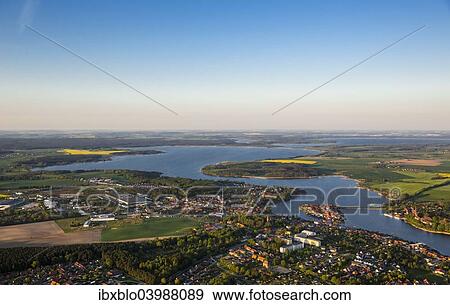 Stock Photo - "Aerial view, Malchow with Malchower See lake and the island with the historic centre and its old market square, Malchow, Mecklenburg Lake District, Mecklenburg-Western Pomerania, Germany, Europe". Fotosearch