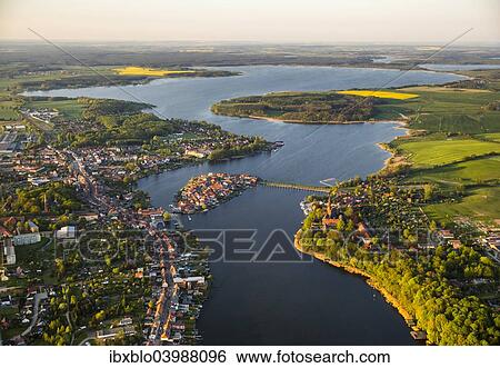 Stock Photograph - "Aerial view, Malchow with Malchower See lake and the island with the historic centre and its old market square, Malchow, Mecklenburg Lake District, Mecklenburg-Western Pomerania, Germany, Europe". Fotosearch