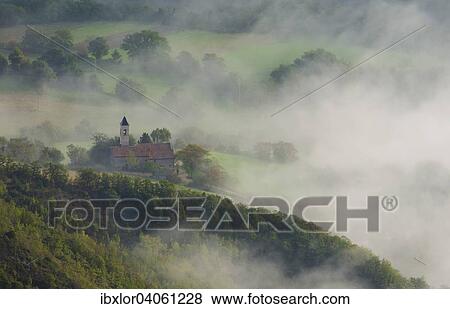 "Aerial view of a small church in fog, Mount Cucco, Apennines, Umbria, Italy, Europe" View Large Photo Image Stock Photo - "Aerial view of a small church in fog, Mount Cucco, Apennines, Umbria, Italy, Europe". Fotosearch