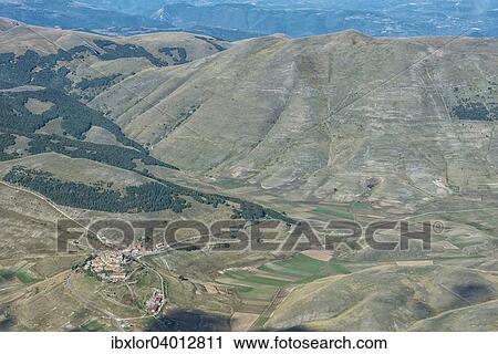 "Aerial view of Piano Grande plateau and village of Castelluccio di Norcia, Monti Sibillini National Park, Umbria, Italy, Europe" View Large Photo Image Stock Image - "Aerial view of Piano Grande plateau and village of Castelluccio di Norcia, Monti Sibillini National Park, Umbria, Italy, Europe". Fotosearch