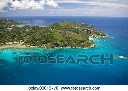 Stock Photo - "Aerial view of the bay of Anse aux Poules Bleues, Anse Aux Poules Bleues, Sud-Mahe, Mahe, Seychelles, Africa". Fotosearch