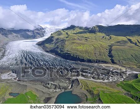 "Aerial view of the glacier tongue of Svinanesjoekull Glacier, a part of Vatnajoekull or Vatna Glacier, Southern Region, Iceland, Europe" View Large Photo Image Picture - "Aerial view of the glacier tongue of Svinanesjoekull Glacier, a part of Vatnajoekull or Vatna Glacier, Southern Region, Iceland, Europe". Fotosearch