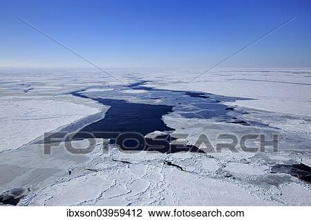 Stock Image - "Aerial view, pack ice, Magdalen Islands, Gulf of Saint Lawrence, Quebec, Canada, North America". Fotosearch