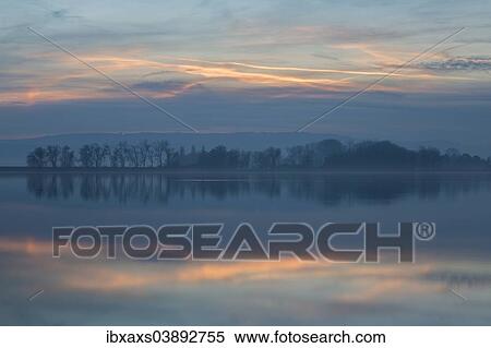 "Afterglow, reflection in Lake Constance, Markelfingen, Radolfzell am Bodensee, Baden-Wurttemberg, Germany, Europe" View Large Photo Image Stock Photography - "Afterglow, reflection in Lake Constance, Markelfingen, Radolfzell am Bodensee, Baden-Wurttemberg, Germany, Europe". Fotosearch