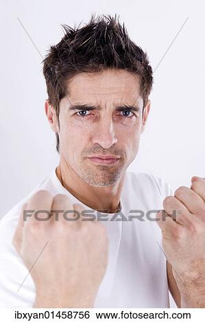 Aggressive man with clenched fist View Large Photo Image Stock Photograph - Aggressive man with clenched fist. Fotosearch