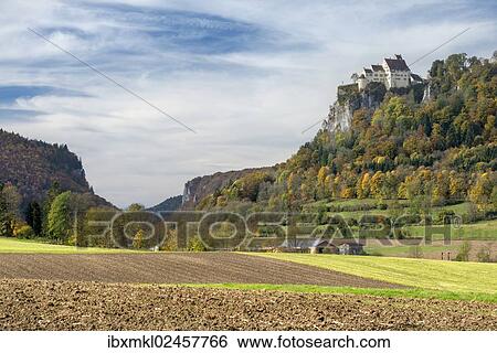 Stock Photograph - "Agricultural land in the Upper Danube Valley, Schloss Werenwag Castle, right, high up on a cliff, Baden-Wuerttemberg, Germany, Europe". Fotosearch