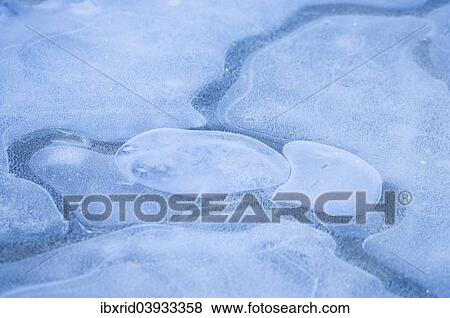 Stock Photo - Air bubbles in ice. Fotosearch