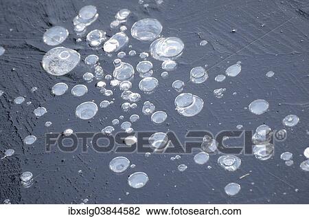 "Air bubbles trapped in ice, Bavaria, Germany, Europe" View Large Photo Image Stock Image - "Air bubbles trapped in ice, Bavaria, Germany, Europe". Fotosearch
