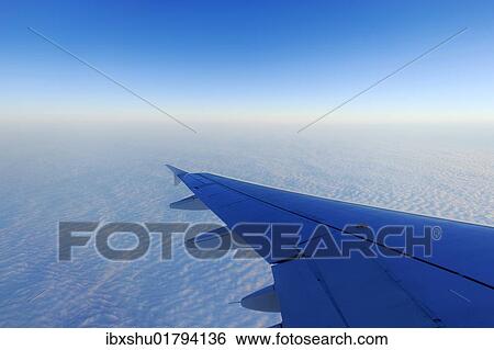 "Airplane wings over a sea of fog, Basel, Switzerland, Europe" View Large Photo Image Stock Photograph - "Airplane wings over a sea of fog, Basel, Switzerland, Europe". Fotosearch