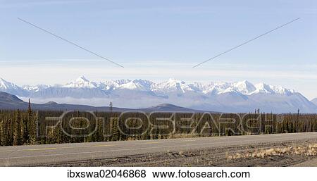 "Alaska Highway, north of Whitehorse, St. Elias Mountains, Kluane National Park and Reserve behind, Yukon Territory, Canada, North America" View Large Photo Image Stock Photo - "Alaska Highway, north of Whitehorse, St. Elias Mountains, Kluane National Park and Reserve behind, Yukon Territory, Canada, North America". Fotosearch