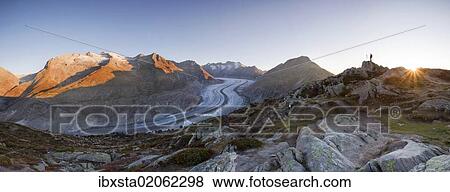 "Aletsch Glacier at first morning light with photographer, from Moosfluh, Riederalp, Valais, Switzerland, Europe" View Large Photo Image Stock Photo - "Aletsch Glacier at first morning light with photographer, from Moosfluh, Riederalp, Valais, Switzerland, Europe". Fotosearch