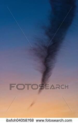 "Almost perpendicular cloud, contrail resolving, in the evening light, North Rhine-Westphalia, Germany, Europe" View Large Photo Image Stock Photo - "Almost perpendicular cloud, contrail resolving, in the evening light, North Rhine-Westphalia, Germany, Europe". Fotosearch