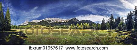 "Alpine meadows and mountain forest with a view on the Wettersteingebirge range, Mt. Suedwand in Leutasch, Tyrol, Austria, Europe" View Large Photo Image Stock Photo - "Alpine meadows and mountain forest with a view on the Wettersteingebirge range, Mt. Suedwand in Leutasch, Tyrol, Austria, Europe". Fotosearch
