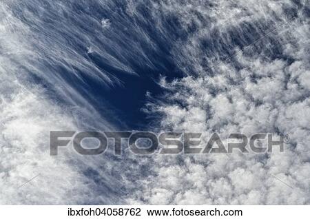 "Altocumulus clouds, Altocumulus Floccus, on top with stripes against a blue sky, North Rhine-Westphalia, Germany, Europe" View Large Photo Image Stock Image - "Altocumulus clouds, Altocumulus Floccus, on top with stripes against a blue sky, North Rhine-Westphalia, Germany, Europe". Fotosearch