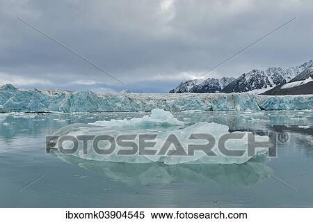 "An iceberg and the escarpment of the glacier, Monacobreen glacier, Liefdefjorden fjord, Spitsbergen, Svalbard Islands, Svalbard and Jan Mayen, Norway, Europe" View Large Photo Image Stock Photography - "An iceberg and the escarpment of the glacier, Monacobreen glacier, Liefdefjorden fjord, Spitsbergen, Svalbard Islands, Svalbard and Jan Mayen, Norway, Europe". Fotosearch