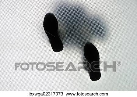 Anonymous walking person from below View Large Photo Image Stock Image - Anonymous walking person from below. Fotosearch