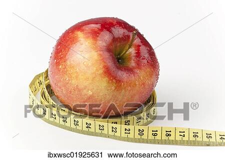 Apple with measuring tape View Large Photo Image Stock Image - Apple with measuring tape. Fotosearch