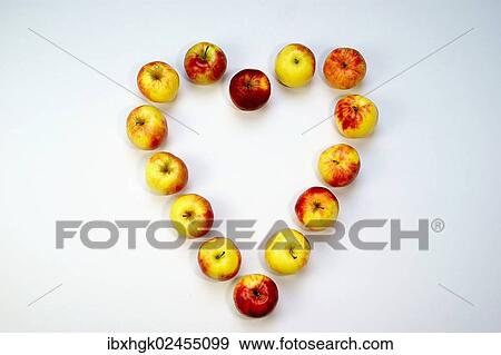 Stock Photo - "Apples, Jonagold, forming a heart-shape". Fotosearch