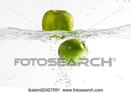 Stock Image - "Apples, splash, water". Fotosearch
