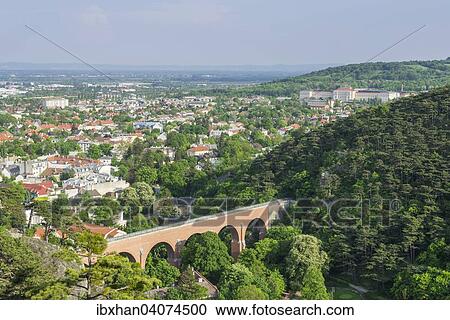 Stock Image - "Aqueduct of the Vienna Mountain Spring Pipeline and cityscape, Modling, Lower Austria, Austria, Europe". Fotosearch