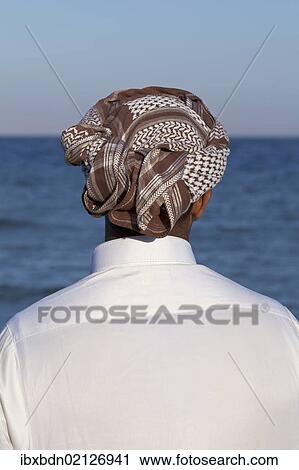 "Arab man looking out at the sea, rear view, Egypt, Africa" View Large Photo Image Stock Image - "Arab man looking out at the sea, rear view, Egypt, Africa". Fotosearch