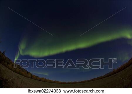 Stock Photo - "Arc of northern polar lights, Aurora Borealis, green, near Whitehorse, Yukon Territory, Canada, North America". Fotosearch
