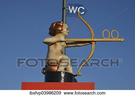 "Archer Cupid as a toilet sign, Oktoberfest, Munich, Upper Bavaria, Bavaria, Germany, Europe" View Large Photo Image Stock Photo - "Archer Cupid as a toilet sign, Oktoberfest, Munich, Upper Bavaria, Bavaria, Germany, Europe". Fotosearch