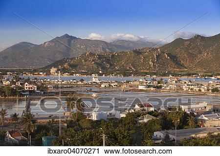 "Artificial small lake for the production of salt, on the outskirts of Phan Rang in the mountainous hinterland of Ninh Thuan, Vietnam, Asia" View Large Photo Image Stock Image - "Artificial small lake for the production of salt, on the outskirts of Phan Rang in the mountainous hinterland of Ninh Thuan, Vietnam, Asia". Fotosearch
