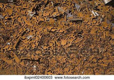 Stock Image - "Assorted rusted metal brackets at a scrap metal recycling junkyard, Quebec, Canada, North America". Fotosearch