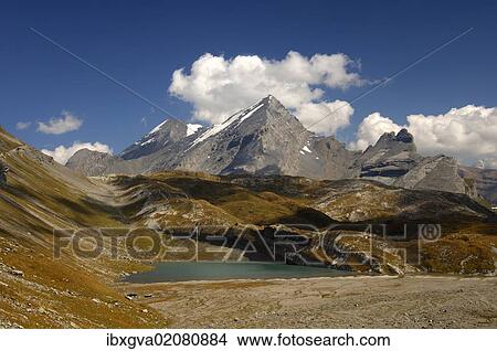 Picture - "At Laemmerensee Lake, view of the peaks of Mt Atels, Mt Rinderhorn and Mt Plattenhoerner, Bernese Alps, Switzerland, Europe". Fotosearch
