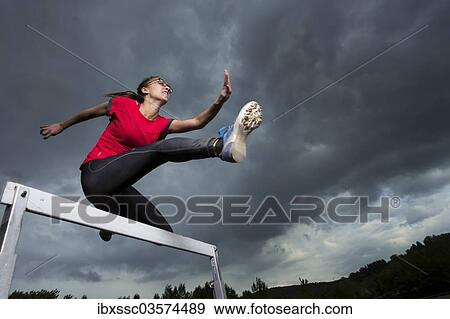 "Athlete, 20 years, jumping hurdles, Winterbach, Baden-Wurttemberg, Germany, Europe" View Large Photo Image Stock Photo - "Athlete, 20 years, jumping hurdles, Winterbach, Baden-Wurttemberg, Germany, Europe". Fotosearch