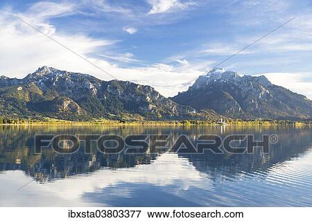 "Autumn mood with mountain views on Forggensee lake near Fussen, East Allgau, Bavaria, Germany, Europe" View Large Photo Image Stock Photo - "Autumn mood with mountain views on Forggensee lake near Fussen, East Allgau, Bavaria, Germany, Europe". Fotosearch