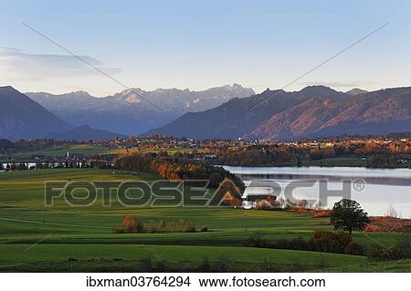 "Autumn morning in the foothills of the Alps, view from Mt Aidlinger Hoehe across Riegsee Lake, Froschhausen, Murnau and Mt Zugspitze, Aidling, Riegsee, Pfaffenwinkel region, Upper Bavaria, Bavaria, Germany, Europe" View Large Photo Image Picture - "Autumn morning in the foothills of the Alps, view from Mt Aidlinger Hoehe across Riegsee Lake, Froschhausen, Murnau and Mt Zugspitze, Aidling, Riegsee, Pfaffenwinkel region, Upper Bavaria, Bavaria, Germany, Europe". Fotosearch