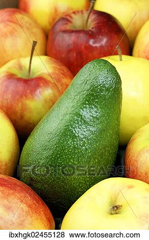 Stock Photo - "Avocado and organic apples, Jonagold". Fotosearch