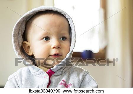 "Baby, 10 months, wearing a hood" View Large Photo Image Stock Image - "Baby, 10 months, wearing a hood". Fotosearch