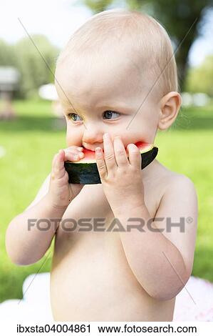 Stock Image - "Baby, 12-14 months, eating watermelon". Fotosearch