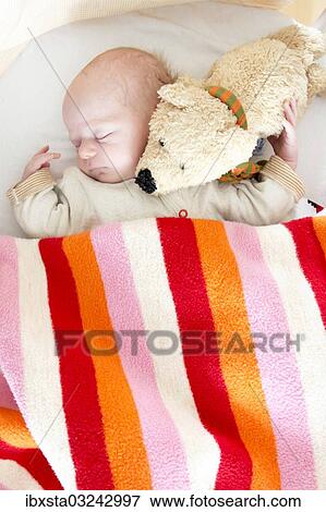 "Baby, 2 months, asleep with a cuddly toy, Germany, Europe" View Large Photo Image Stock Photo - "Baby, 2 months, asleep with a cuddly toy, Germany, Europe". Fotosearch