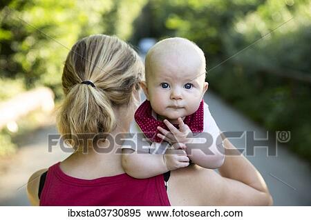 "Baby, 4-5 months old, on its mother's arm, Germany, Europe" View Large Photo Image Stock Photography - "Baby, 4-5 months old, on its mother's arm, Germany, Europe". Fotosearch