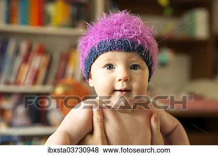 "Baby, 4-5 months old, wearing a cap, Germany, Europe" View Large Photo Image Stock Photo - "Baby, 4-5 months old, wearing a cap, Germany, Europe". Fotosearch