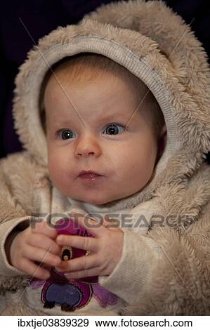 Stock Photo - "Baby girl, 2 months, wearing a faux fur suit". Fotosearch
