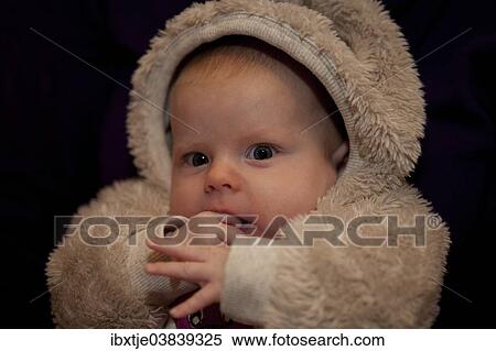 "Baby girl, 2 months, wearing a faux fur suit" View Large Photo Image Stock Photography - "Baby girl, 2 months, wearing a faux fur suit". Fotosearch