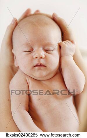 "Baby girl, 3 months, being held by hands, portrait" View Large Photo Image Stock Photography - "Baby girl, 3 months, being held by hands, portrait". Fotosearch