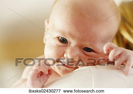 "Baby girl, 3 months, being held by the mother, portrait" View Large Photo Image Stock Photo - "Baby girl, 3 months, being held by the mother, portrait". Fotosearch