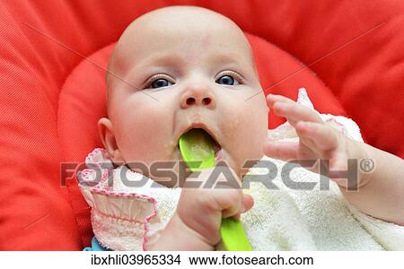 "Baby, girl, six months, fed with baby food, Germany, Europe" View Large Photo Image Picture - "Baby, girl, six months, fed with baby food, Germany, Europe". Fotosearch