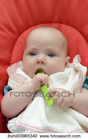 "Baby, girl, six months, with spoon in her mouth, Germany, Europe" View Large Photo Image Stock Image - "Baby, girl, six months, with spoon in her mouth, Germany, Europe". Fotosearch