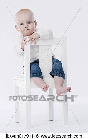 Baby on high chair View Large Photo Image Stock Photograph - Baby on high chair. Fotosearch