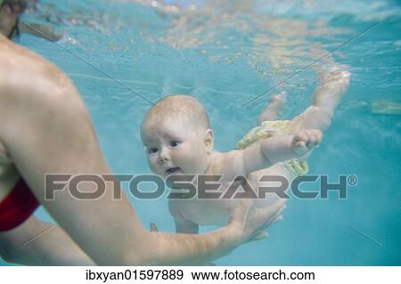 Stock Photo - Baby swimming. Fotosearch